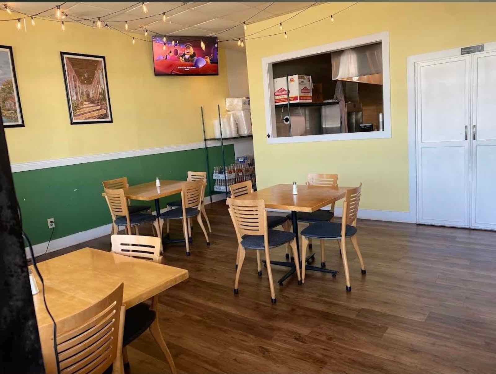 Dining room with wooden tables and string lights