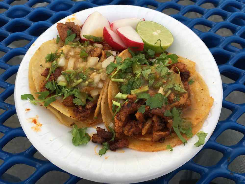Street tacos with onion, cilantro, radish and lime